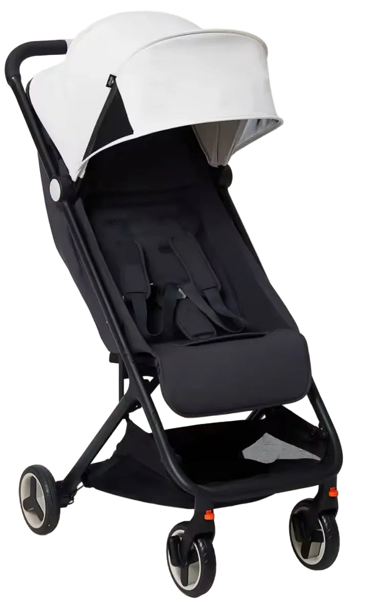 Black and white baby stroller on a beige background