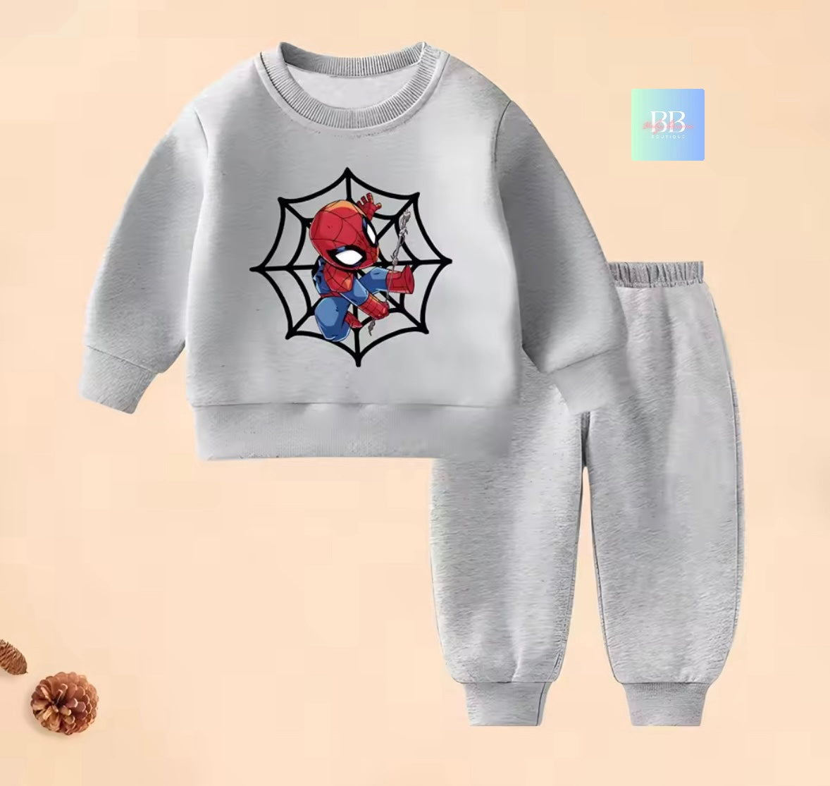 Children's gray sweatshirt and pants set with Spider-Man design on a beige background