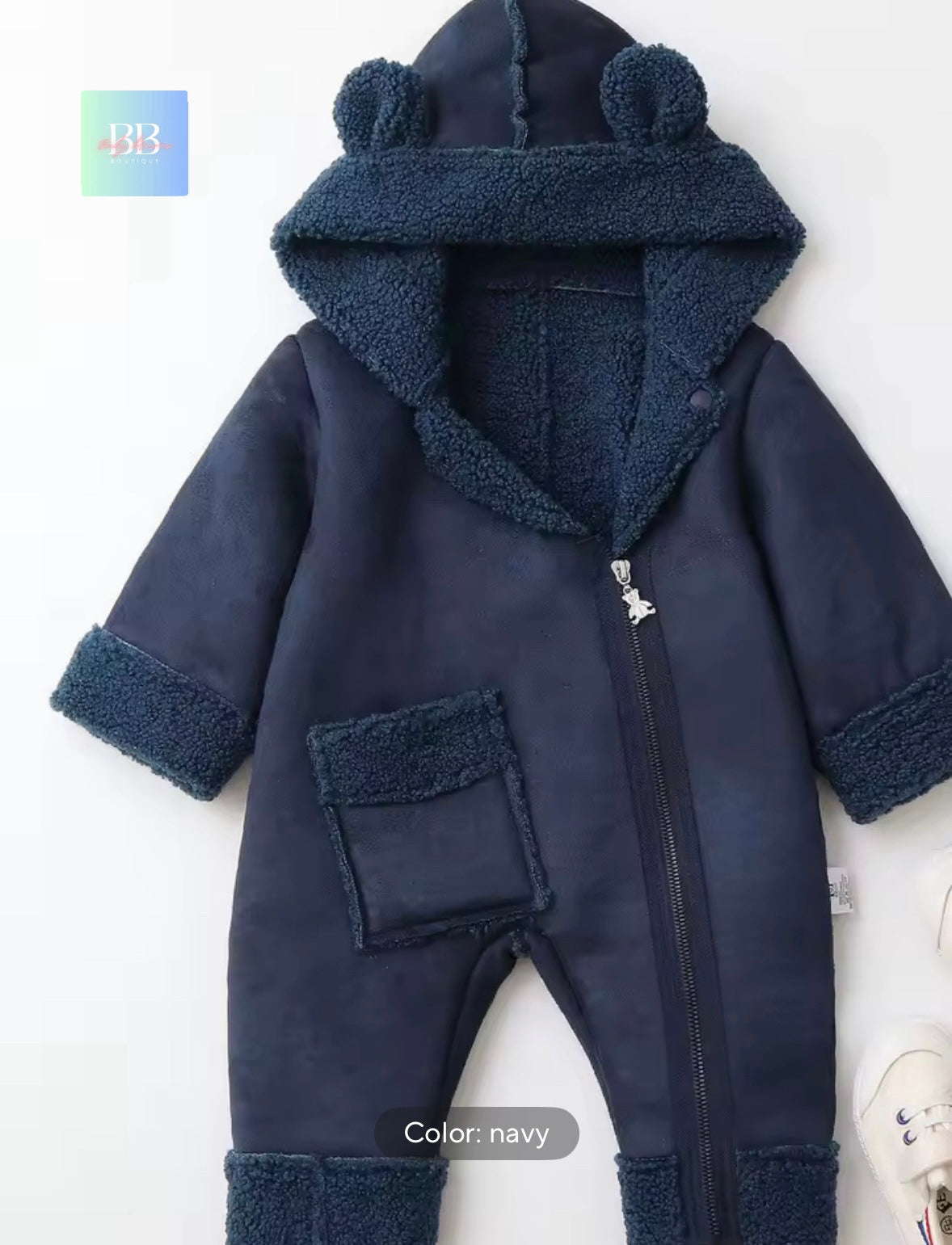 Navy blue baby onesie with hood on a white background