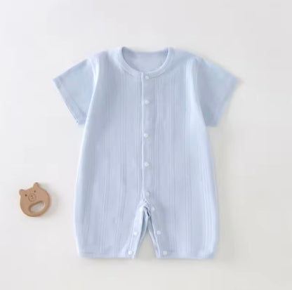 Light blue baby romper with buttons on a white background