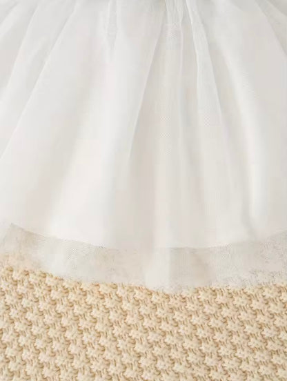 Close-up of a white fabric with a textured beige border