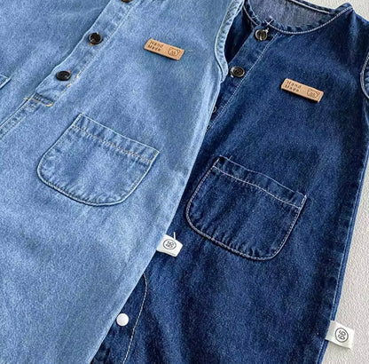 Close-up of a blue denim shirt with brand labels on a light gray background