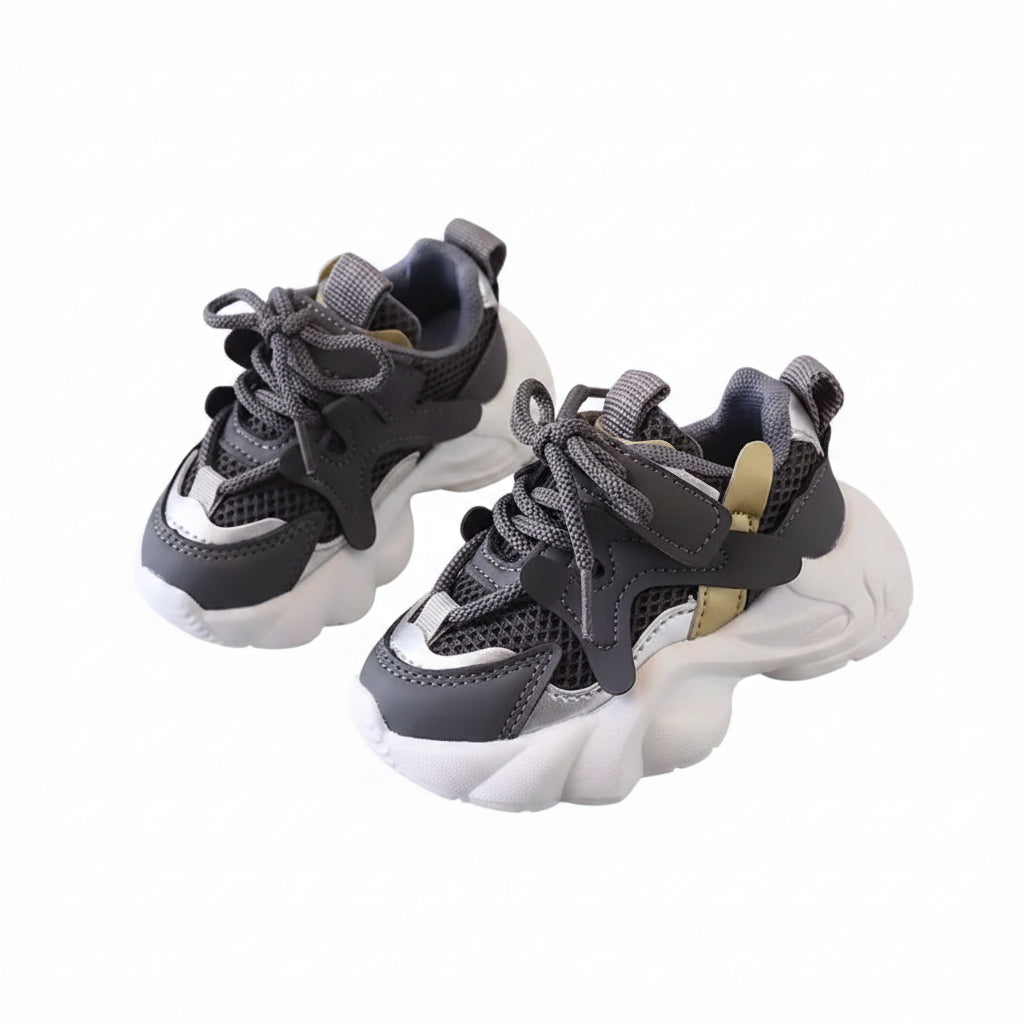 Pair of gray and white sneakers on a gray surface with 'XISHAN 731' branding.