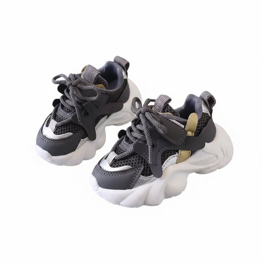 Pair of gray and white sneakers on a gray surface with 'XISHAN 731' branding.