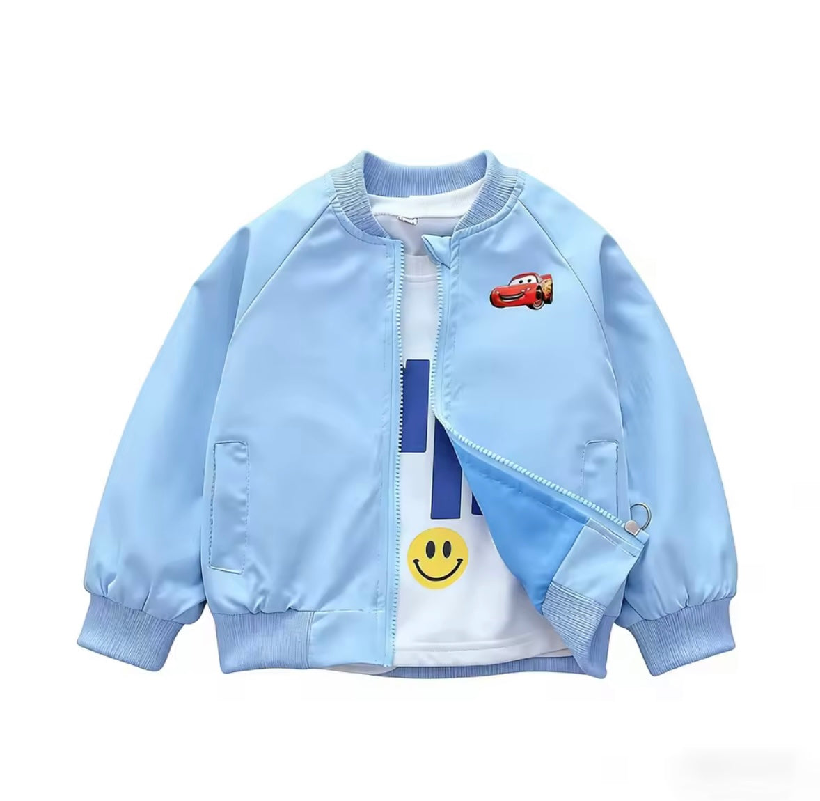 Light blue children's jacket with cartoon car and smiley face design on a white background