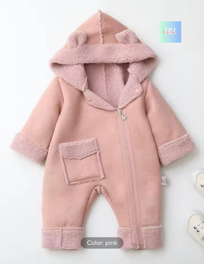 Pink baby snowsuit with hood on a white background