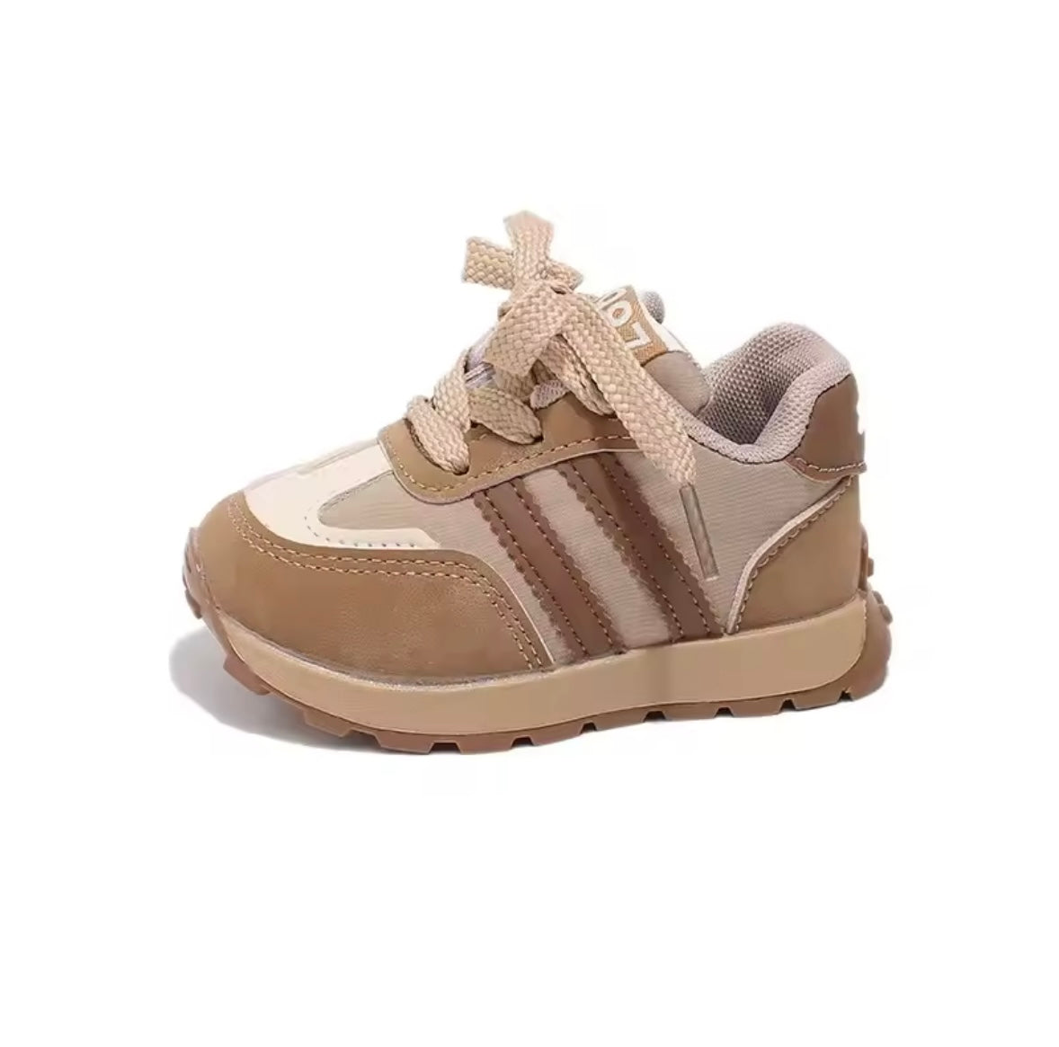 Beige and brown children's sneaker on a white background