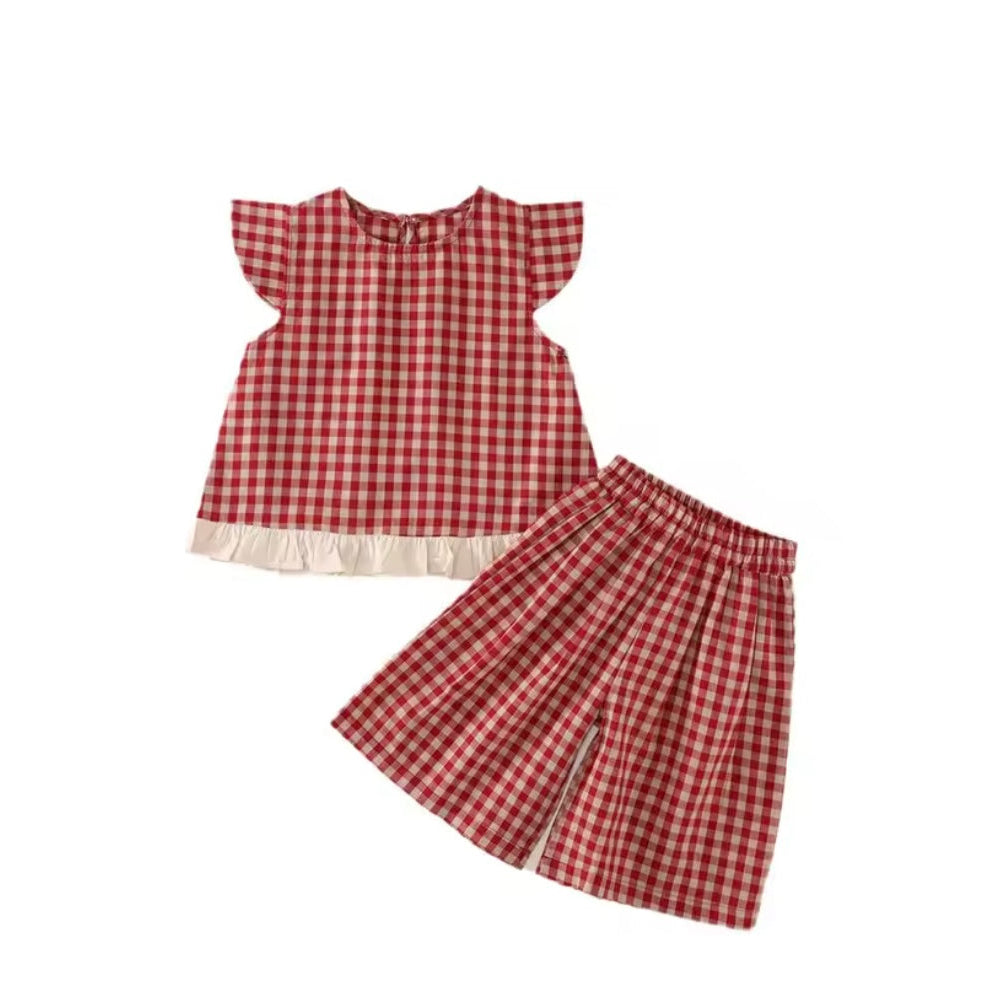 Red and white checkered dress and shorts set on a white background