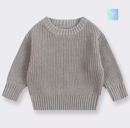 Gray knitted sweater on a light gray background