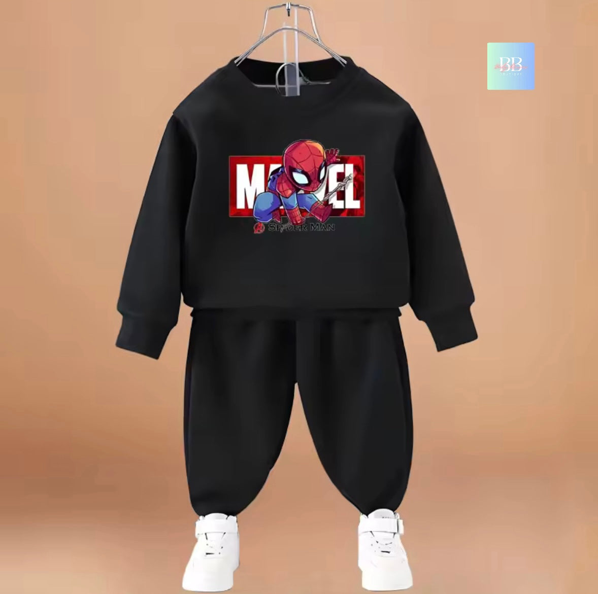 Black children's outfit with Spider-Man graphic on a brown background