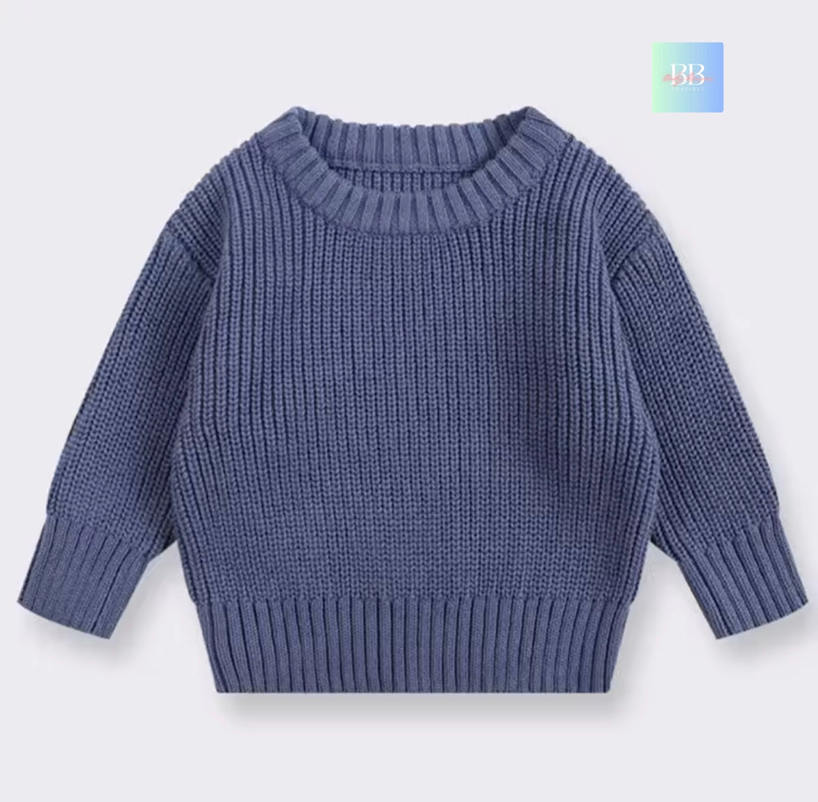 Blue knitted sweater on a light gray background