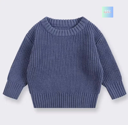 Blue knitted sweater on a light gray background