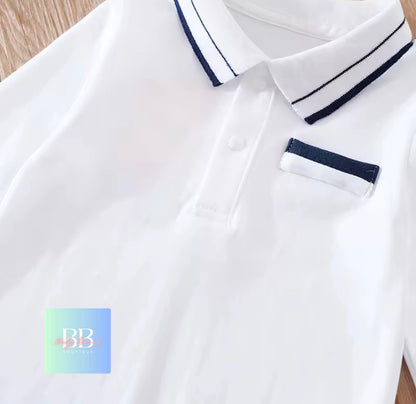 White polo shirt with blue trim and a visible brand logo on a wooden surface