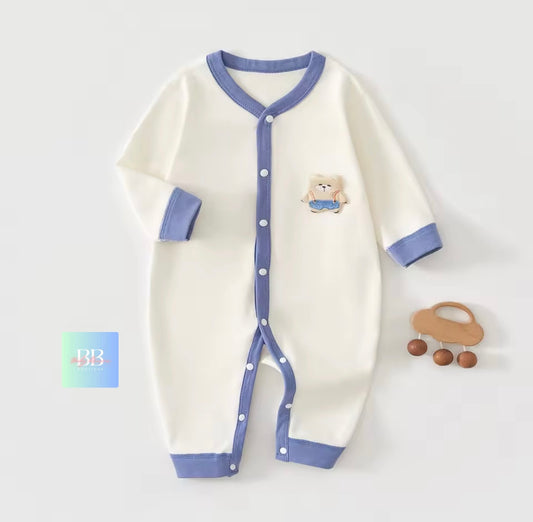 Baby onesie with blue trim on a white background