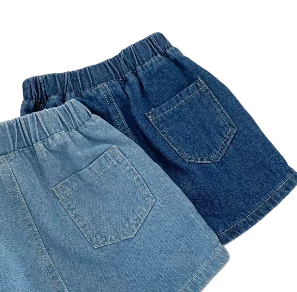 Two pairs of blue denim shorts on a light background