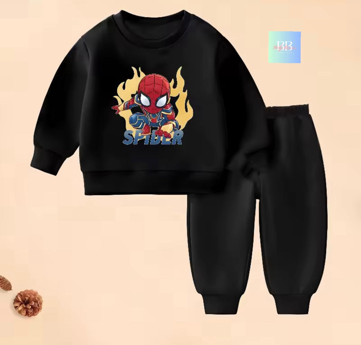 Black children's sweatshirt and pants set with Spider-Man design on a beige background