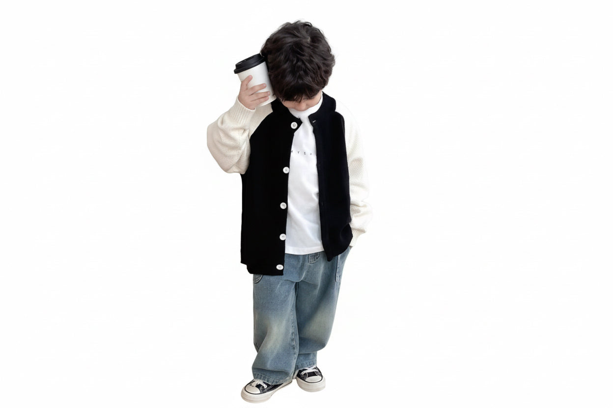 Person wearing a letterman jacket and jeans on a white background
