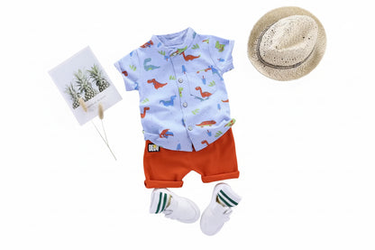 Baby outfit with shirt, shorts, socks, and hat on a gray background