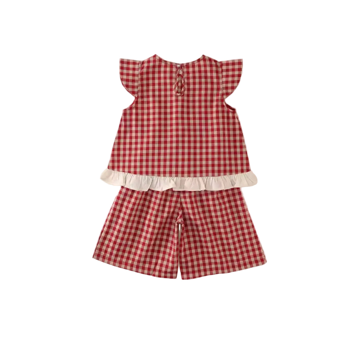 Red and white checkered outfit with a top and shorts on a light beige background