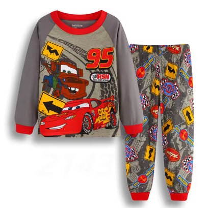 Children's pajama set with race car design on a white background
