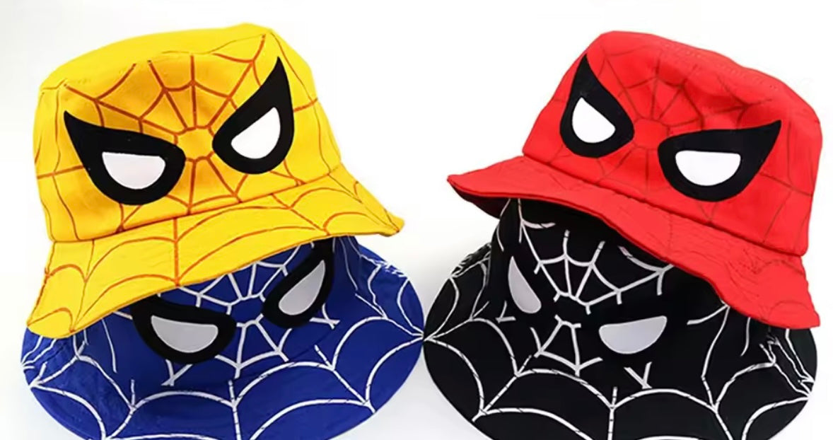 Two bucket hats with spider-themed designs in yellow, red, and blue on a white background.