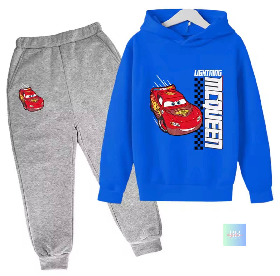 Blue hoodie with Lightning McQueen design and gray pants on a white background