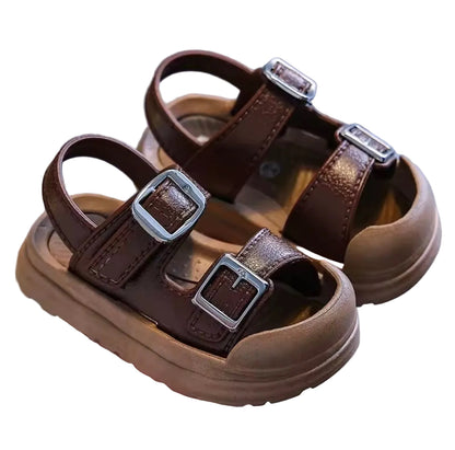 Brown children's sandals with buckles on a white background
