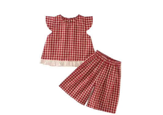 Red and white checkered dress and skirt set on a beige background