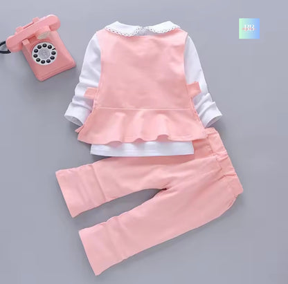 Children's pink outfit with white shirt on a gray background