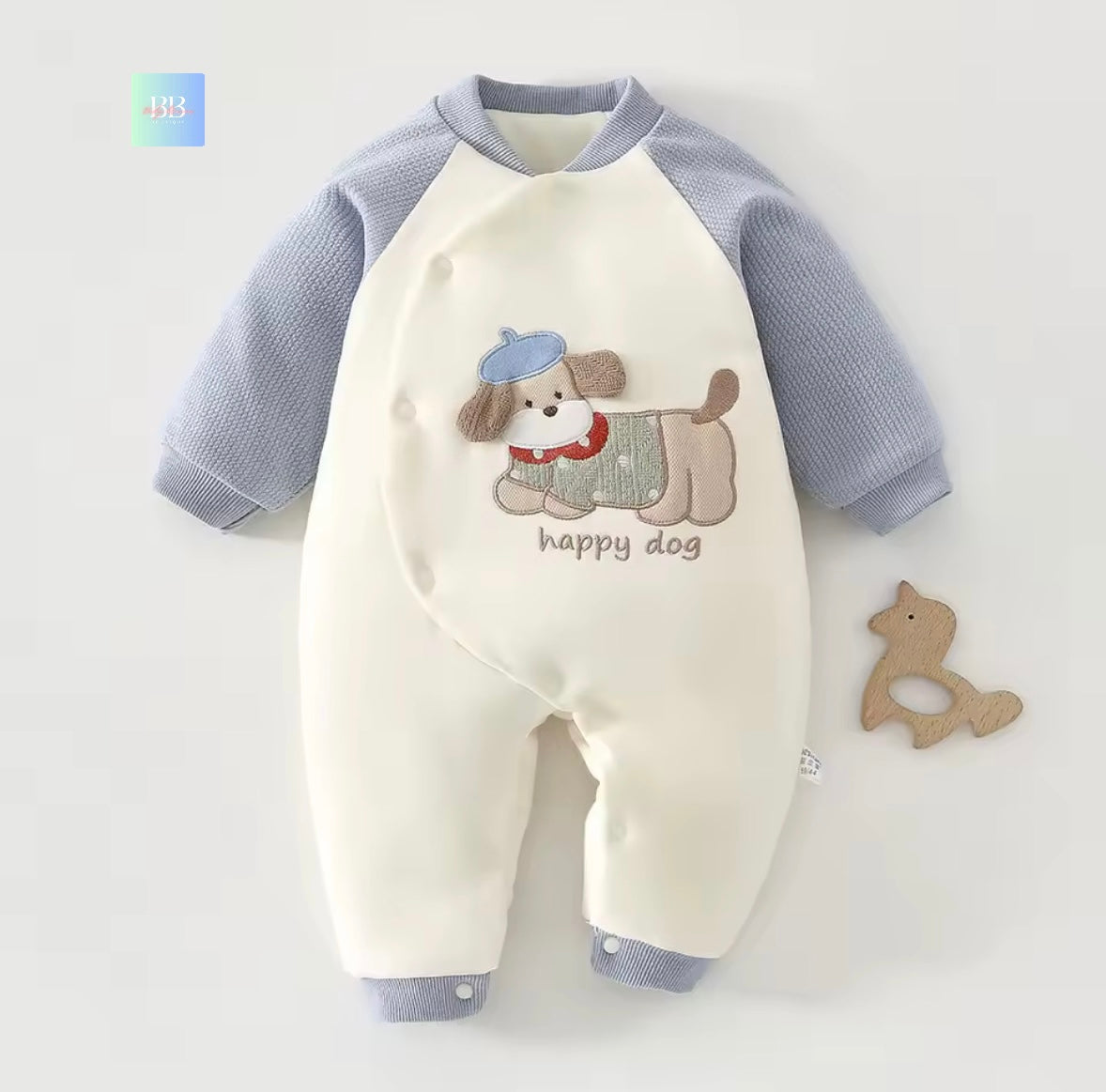 Baby romper with dog design and 'happy dog' text on a light gray background