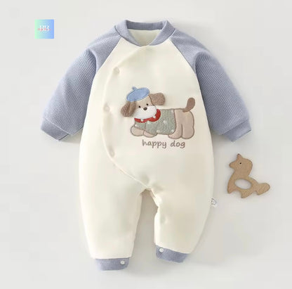 Baby romper with dog design and 'happy dog' text on a light gray background