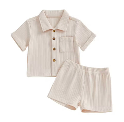 Beige ribbed shirt and shorts set on a white background