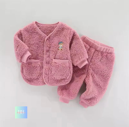 Pink children's fleece set with cartoon character on a light gray background