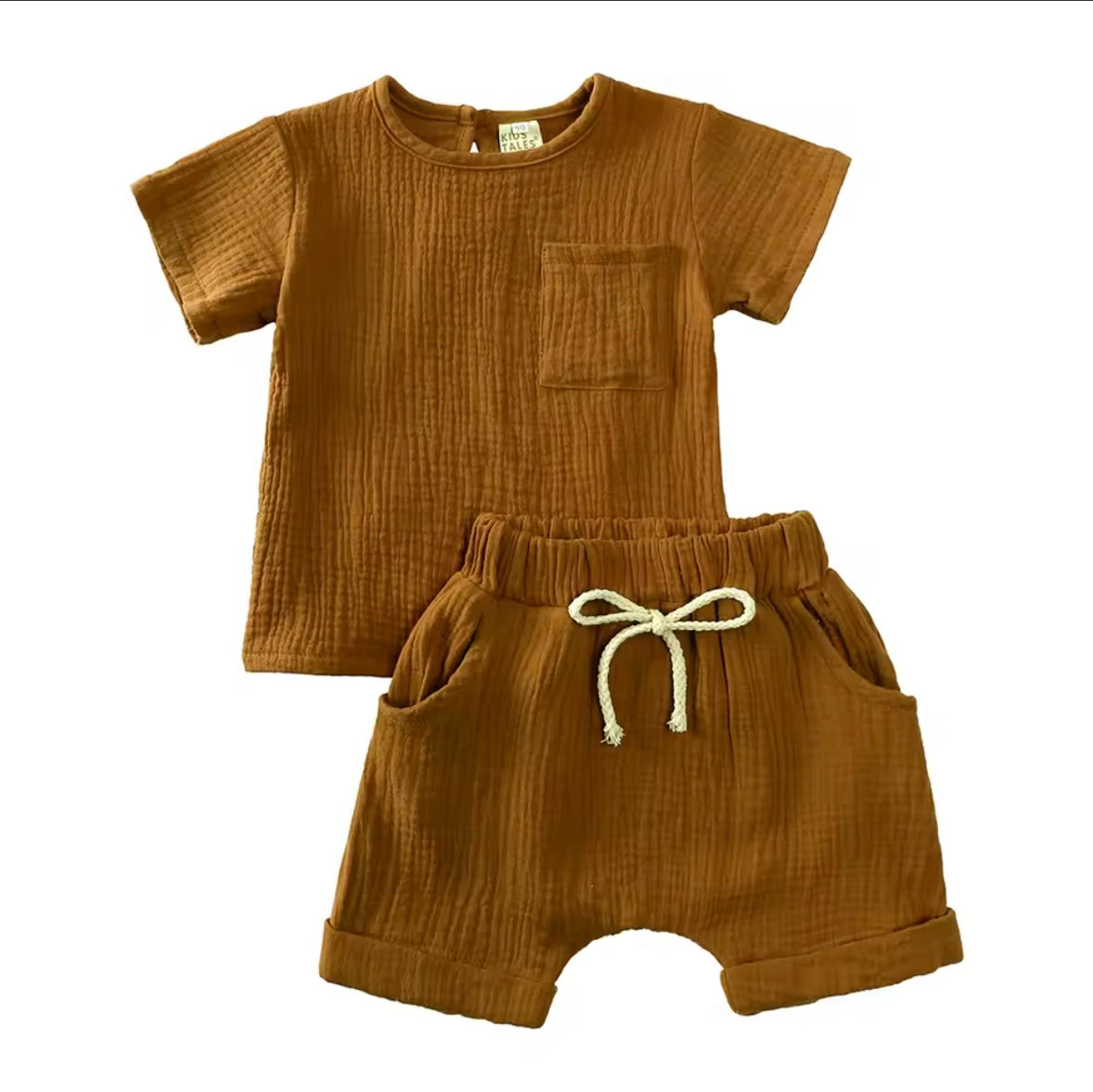 Brown children's outfit with shirt and shorts on a white background