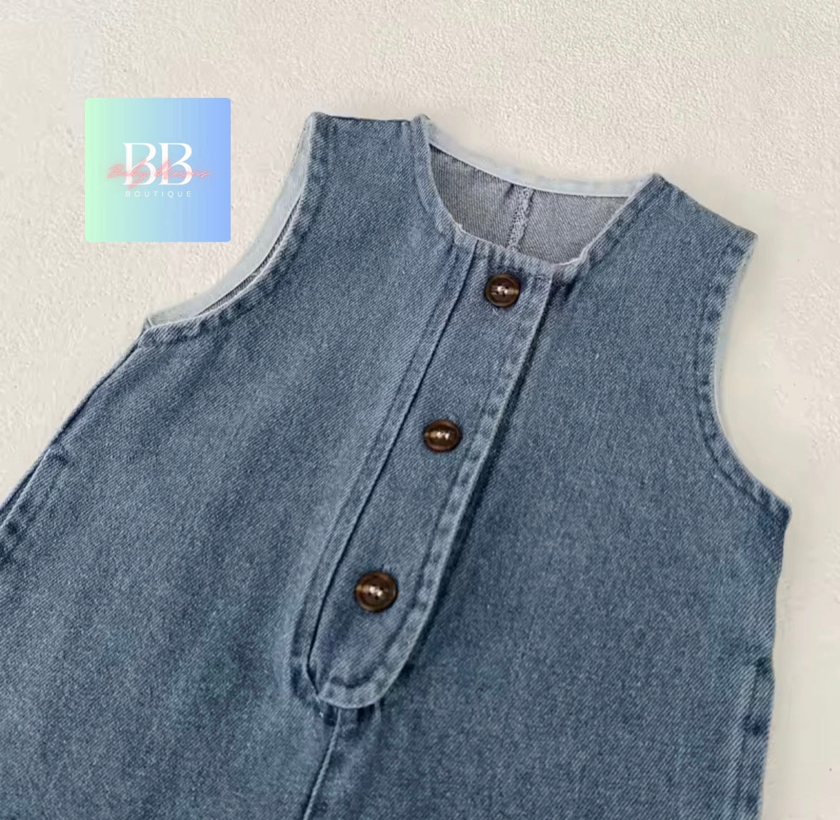 Light blue denim vest with brown buttons on a white background