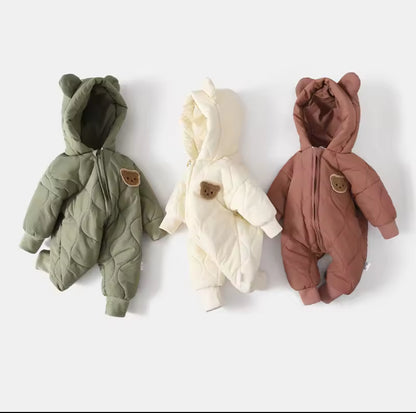 Three baby onesies with bear designs on a white background