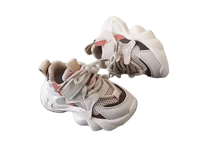 Pair of children's sneakers on a gray surface with 'XISHAN' branding in the background.