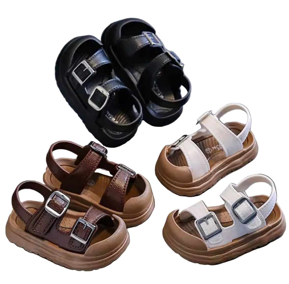 Set of children's sandals in black, brown, and white on a reflective surface.