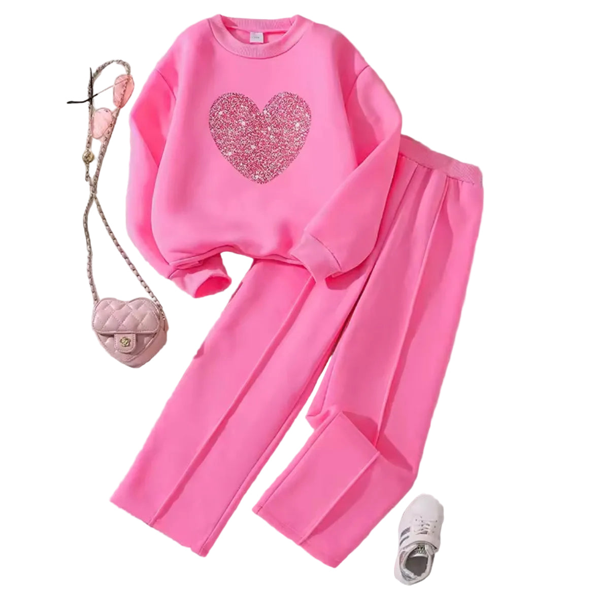 Pink sweatshirt and pants set with a heart design on a light background