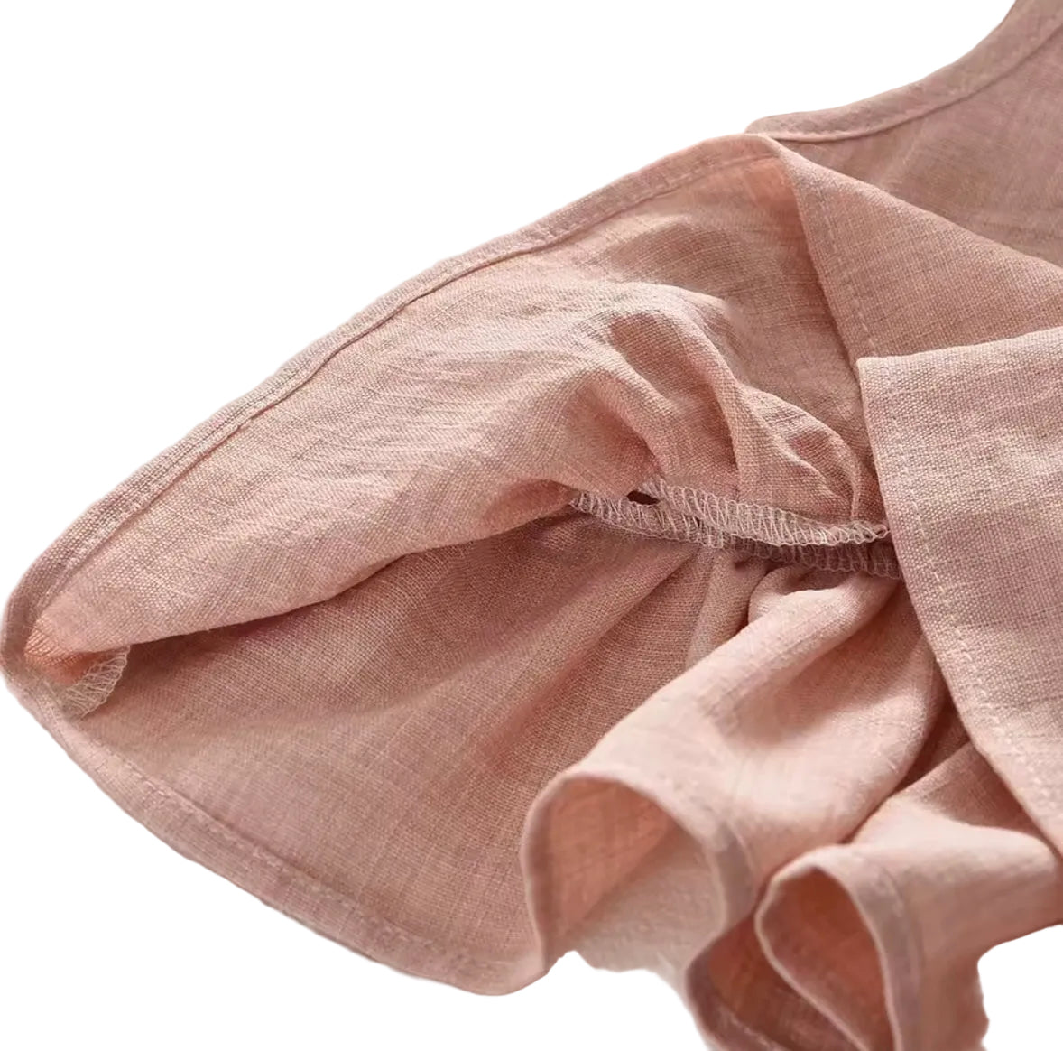Pink fabric with a textured surface on a neutral background