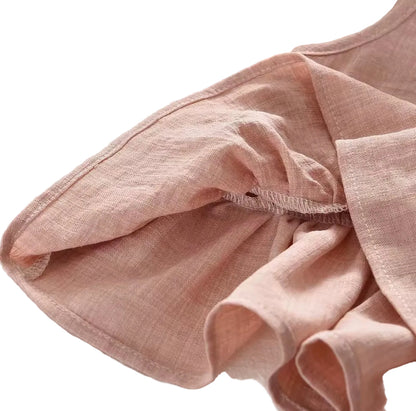 Pink fabric with a textured surface on a neutral background