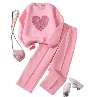 Pink outfit with heart design on a light background