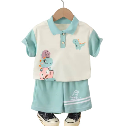 Children's outfit with cartoon designs on a hanger against a striped wall.
