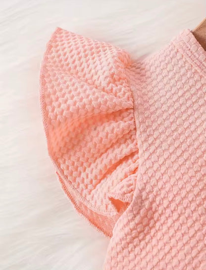 Pink textured towel on a white background