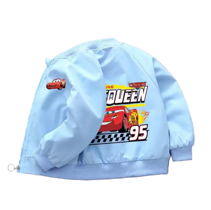 Light blue jacket with cartoon character design on a gray surface