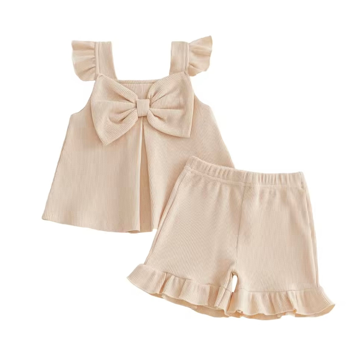 Beige baby dress with ruffled sleeves and shorts on a white background