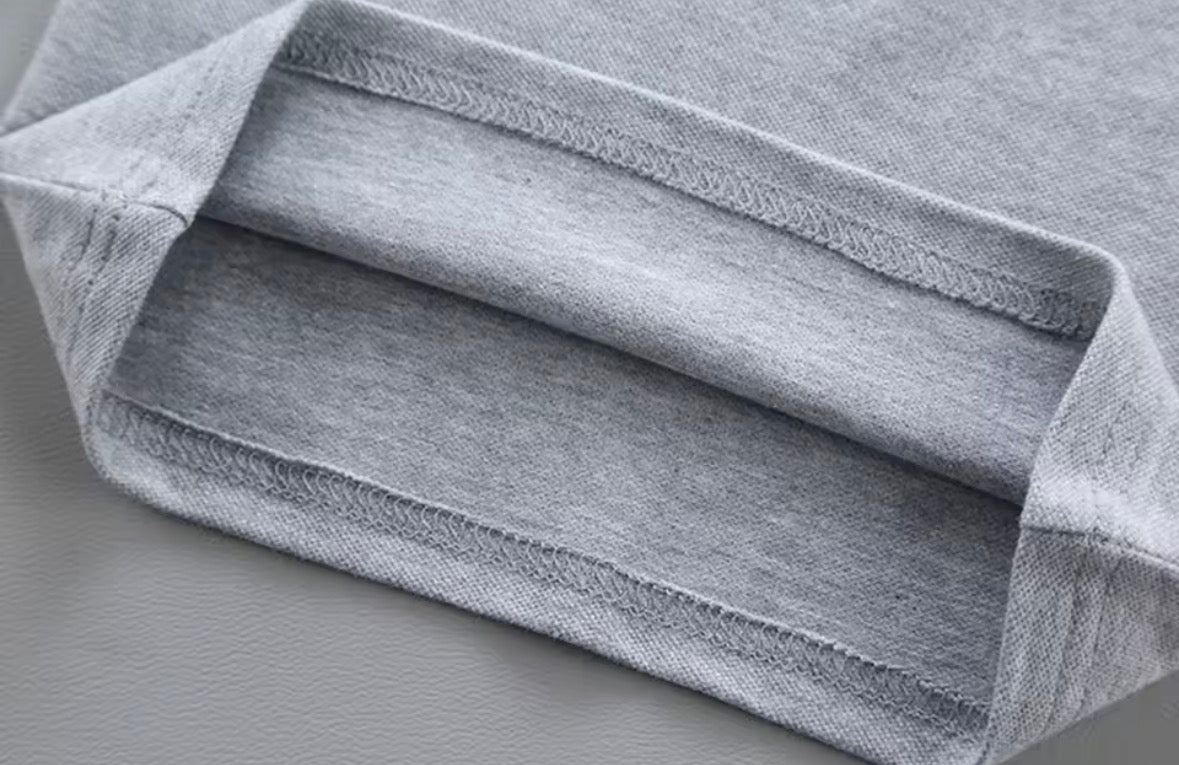 Close-up of gray fabric with a textured surface on a gray background