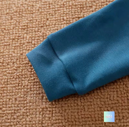 Close-up of a blue fabric edge on a brown textured surface