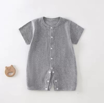 Gray baby romper with buttons on a white background