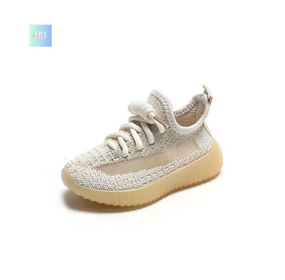 Beige sneaker with white laces on a white background